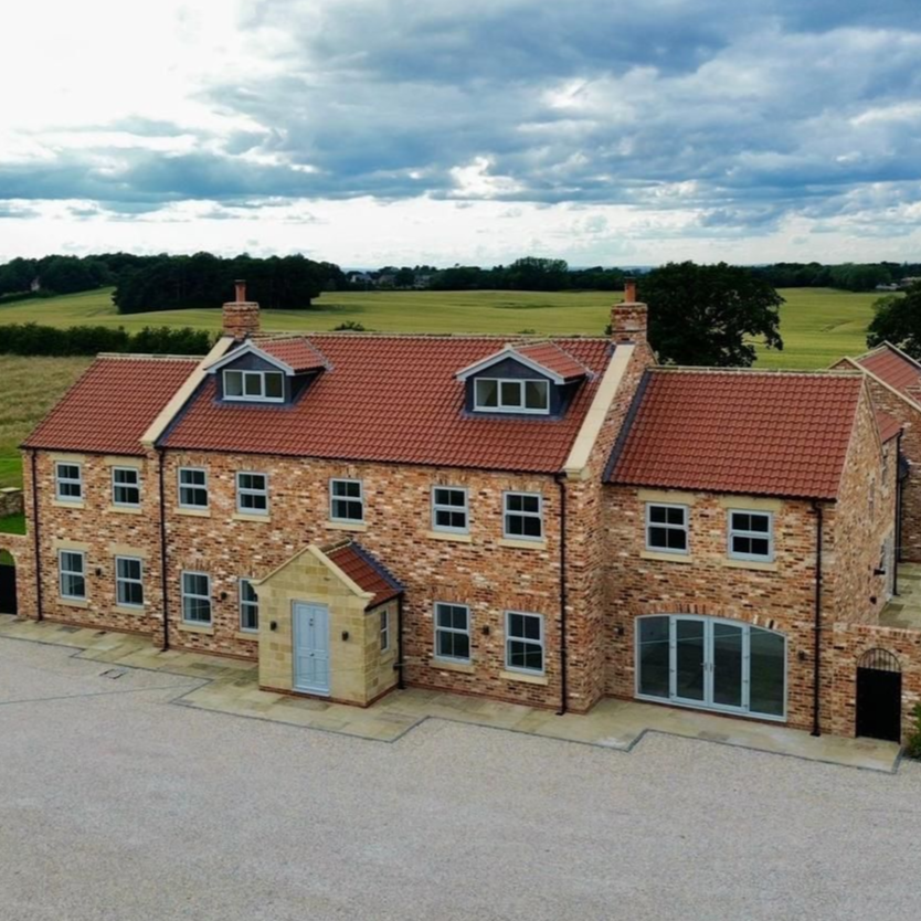country home built from imperial bricks and clay pan tiles supplied by heritage brick company