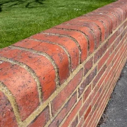 red-brick-boundary-wall-topped
