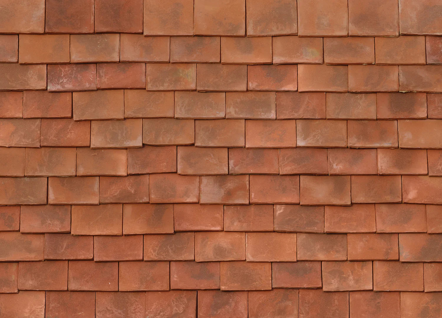 The finest clay roof tiles, handmade using traditional English methods. These beautiful clay tiles offer individuality in appearance and blend 