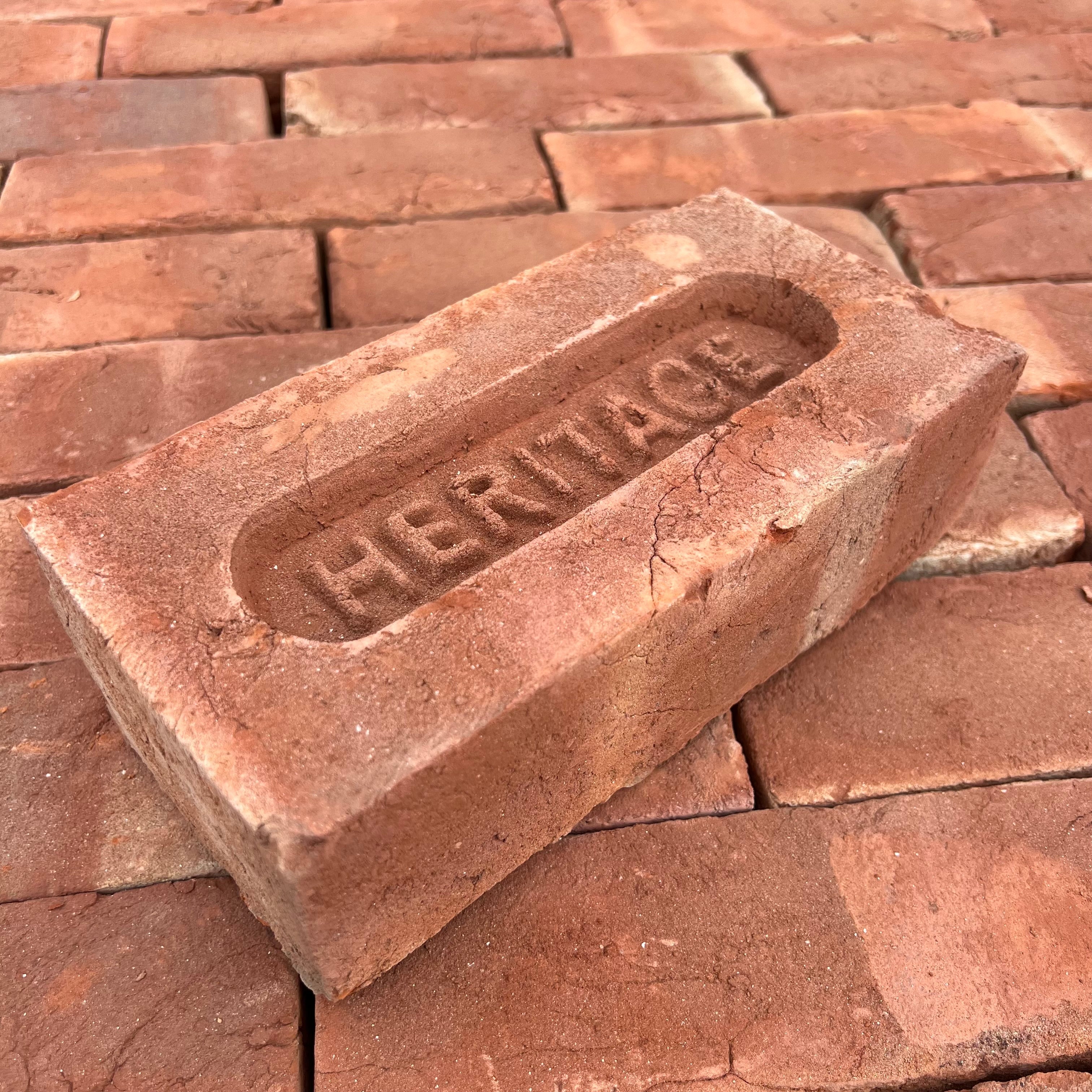 Red handmade bricks with the original stamp 'HERITAGE' - By Heritage Brick Company