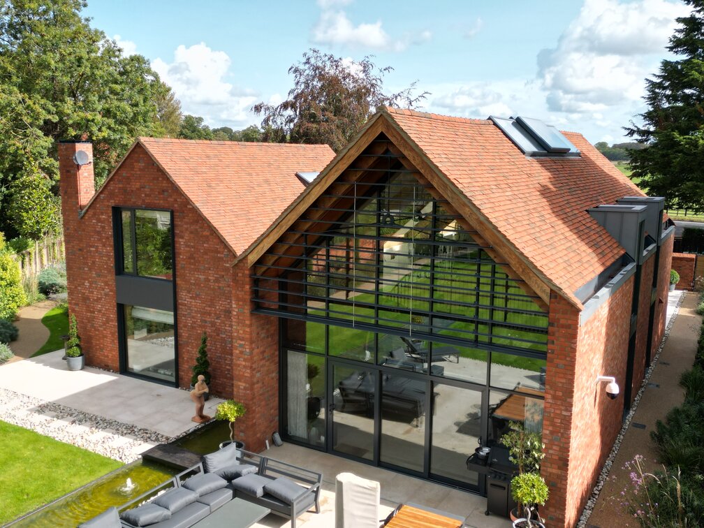 architectural design with handmade bricks and natural clay roofing tiles